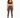 A woman stands confidently in fitted brown leggings paired with a dark sports bra and stylish sneakers.