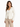 A woman in a fitted cream jacket paired with a white top and beige trousers, showcasing a stylish, professional look.