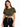 A woman poses in a cropped olive green top with a front tie, paired with black high-waisted leggings.