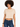 A woman with curly hair wears a cropped beige top paired with dark blue jeans, showcasing a casual style.