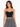 Black cropped top with chain straps, paired with a patterned black and white skirt, worn by a model.