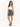 A model poses in a fitted white crop top and a black skirt with a playful print, paired with strappy heels.