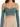 A fitted crop top in teal with thin straps and long sleeves, paired with high-waisted beige trousers.