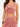 Cropped top with a draped neckline and gold accent, paired with matching soft, relaxed-fit pants.