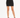 A fitted black skirt paired with strappy black heels, showcasing a sleek silhouette and modern style.