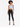 Light blue ribbed crop top with a keyhole detail, paired with black skinny jeans and strappy heels.