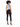 A model with curly hair wears a light blue ribbed crop top and black skinny jeans, showcasing a stylish back view.