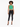 A model poses in a ribbed green crop top with a keyhole detail, paired with black skinny jeans and heels.