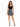 A woman stands confidently in a fitted black top and a flared black and white patterned skirt, paired with strappy he...