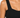 Close-up of a black ribbed top featuring wide straps and a fitted bodice, highlighting its textured fabric.
