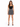 A woman stands confidently in a fitted black crop top paired with a patterned skirt and strappy heels.
