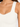 Close-up of a light-colored ribbed top featuring wide straps and a fitted bodice, highlighting a textured design.