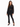A model poses in a sheer black button-up top with intricate patterns, paired with fitted black pants featuring side s...