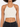 Crochet halter top with a hexagonal pattern, featuring a scalloped hem and paired with high-waisted black jeans.