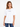 A woman wearing a white oversized tee with short sleeves and a black text graphic, paired with blue jeans.