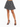 A model showcases a flared black and white patterned skirt paired with strappy black high heels.