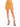 A model wearing a mustard-colored mini skirt with a side slit, paired with black strappy high heels.