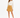 A woman stands confidently in a cream long-sleeve top paired with a mustard mini skirt and black strappy heels.