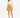 A woman stands confidently in a light blouse with a chain detail and a mustard-colored mini skirt, paired with black...