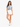 A woman stands confidently in a light blue cropped top and white shorts, paired with white sneakers.