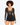 A model poses in a sheer black long-sleeve top with a deep neckline and high-waisted black shorts.