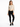A model poses in a fitted, ribbed long-sleeve bodysuit with side cutouts, paired with black skinny jeans and sneakers.