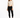 A model poses in a fitted long-sleeve top with cut-out details, paired with black skinny jeans and sneakers.
