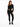 A model wearing a black ribbed bodysuit with cut-out sides, paired with black skinny jeans and sneakers.