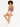 A model with curly hair sits on a white cube, wearing a mauve bodysuit and white shorts, paired with sneakers.