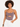 A model with curly hair wears a fitted bodysuit featuring thin straps and a stylish cutout detail.