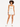 A model poses in a light bodysuit with a cutout, paired with white high-waisted shorts and sneakers.