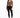 A model poses in a fitted long-sleeve top with a V-neck and cut-out details, paired with black skinny jeans and sneak...
