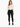 A model wearing a fitted long-sleeve bodysuit with a deep V-neck and cut-out sides, paired with black skinny jeans.