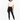 A model wearing black leggings paired with a cropped white t-shirt and stylish black boots.