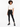 A model wearing black leggings paired with a cropped white t-shirt and stylish black boots.