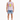 A man stands wearing a sleeveless graphic shirt and distressed denim shorts, paired with white sneakers.