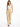 A woman walks confidently in beige high-waisted pants paired with a delicate white camisole and black heels.