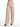 Beige wide-leg pants with pleats, featuring a button closure and side pockets, styled with black heeled sandals.