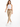 A woman walks confidently in beige pants paired with a white crop top and white sneakers, showcasing a casual style.