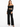 A model wearing black wide-leg pants paired with a cropped off-the-shoulder top and strappy heels.
