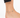 Ankle adorned with a delicate gold chain featuring blue eye-shaped beads, resting on a bare foot.