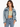 A woman models a light blue cropped denim jacket over a fitted green top, paired with high-waisted jeans.