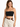 A woman wearing a black cropped top with thin straps, paired with beige high-waisted pants and a braided brown belt.