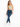 A model poses in a light green cropped top and distressed blue jeans, paired with white sneakers.
