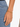 A gold bracelet with spherical beads, elegantly worn on a hand against a denim background.