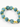 Turquoise and black speckled beads interspersed with gold hexagonal accents form a stylish bracelet.