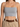Light gray cropped top with thin straps, paired with high-waisted beige trousers and a braided brown belt.