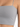 Light gray cropped top with thin straps, featuring a smooth, fitted design and a minimalist aesthetic.