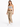 A woman stands confidently in a gray crop top and beige trousers, paired with white sneakers and a braided belt.