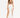 A model poses in a white skirt with high slits, paired with a brown crop top and black strappy heels.